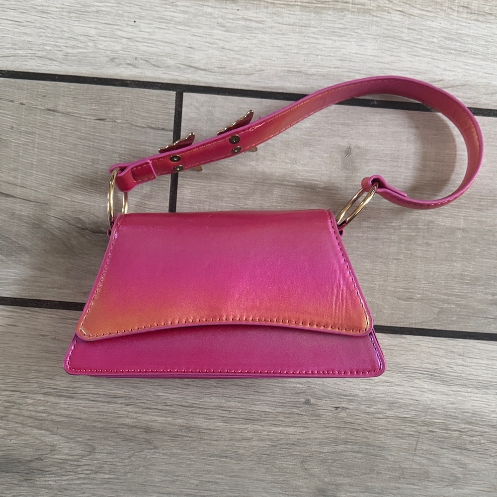 Small iridescent, pink purse with rhinestone butterflies